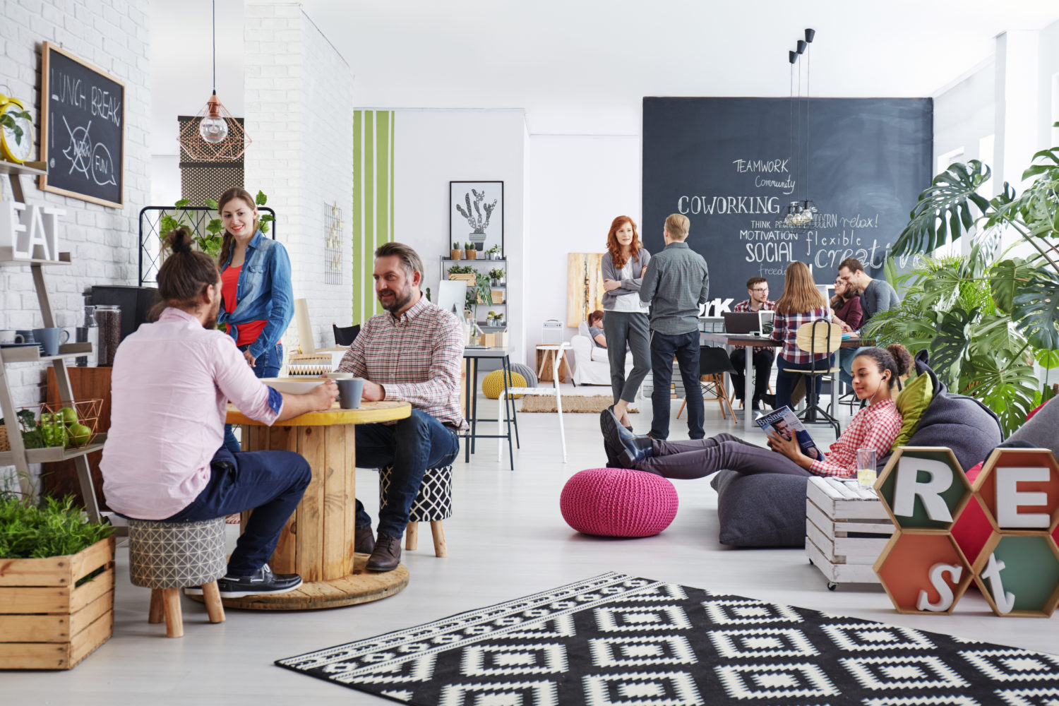 People working in modern agency relaxing during lunch