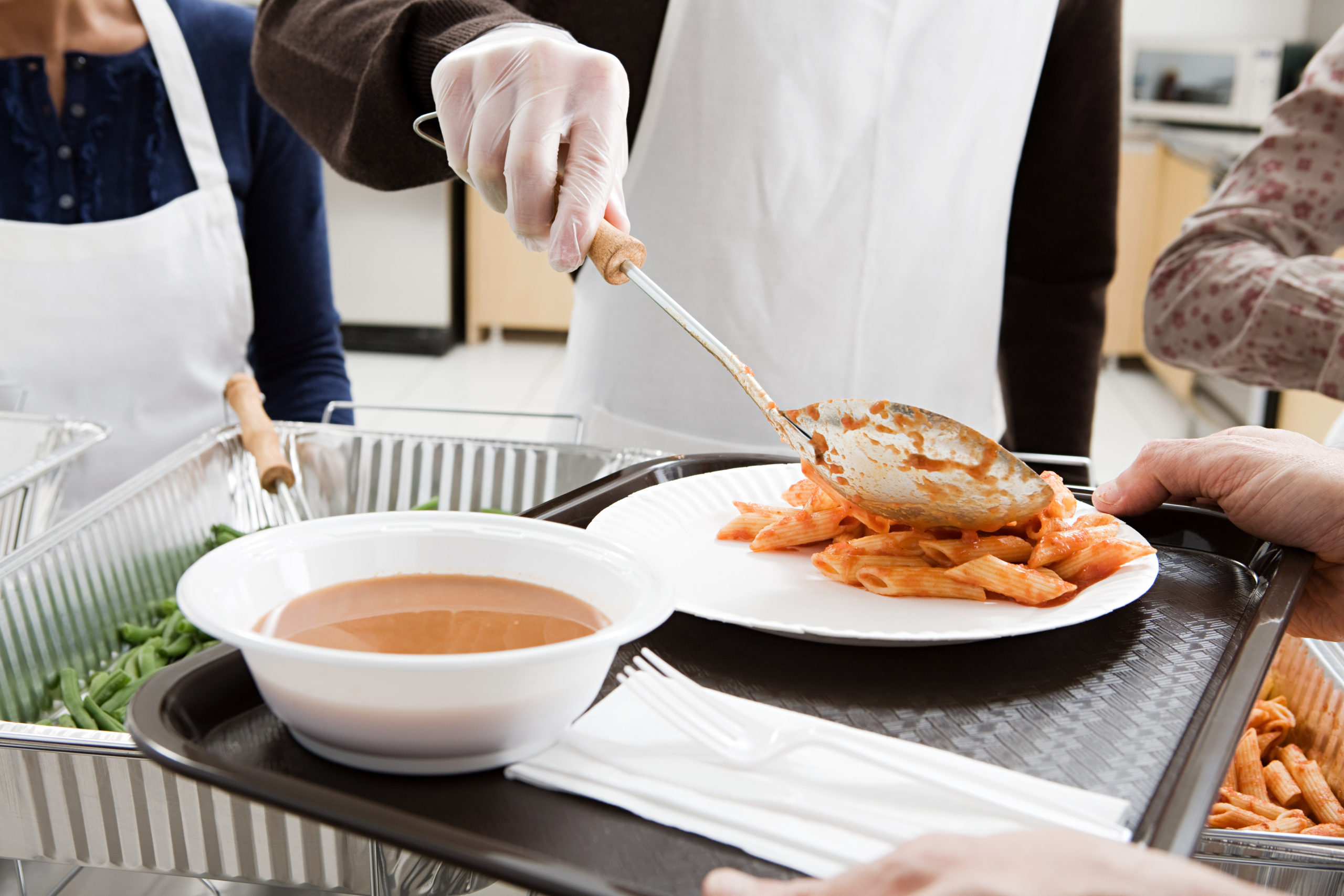 food being served in soup kitchen